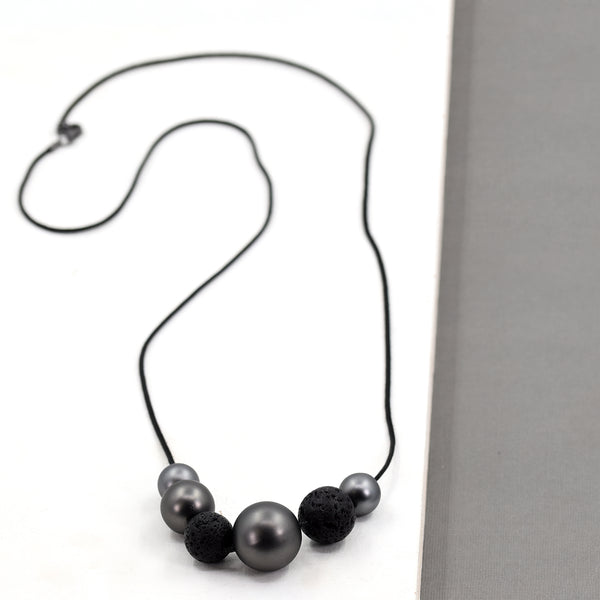 Long black cord necklace with bead pendants