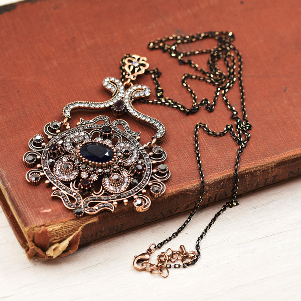 Long victoriana  necklace with circular jewelled pendant
