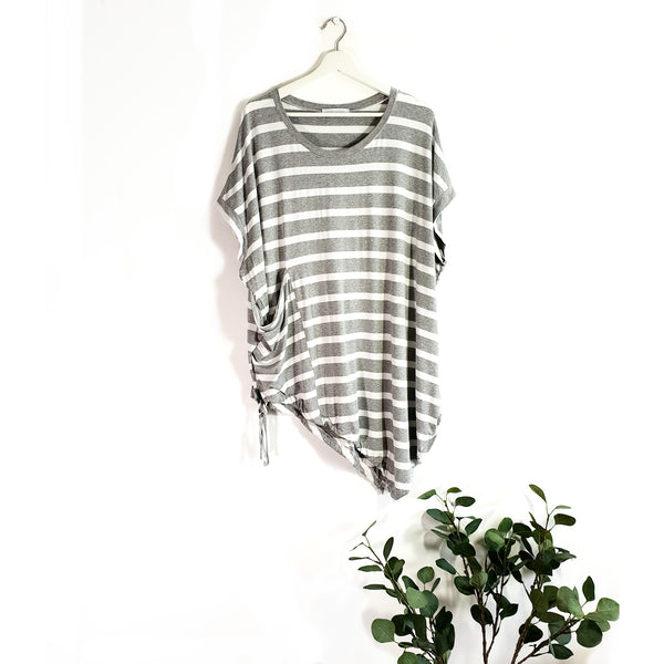 A-symmetric free size stripey top with big patch pocket drawstring element