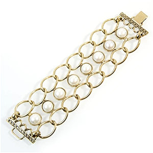 Chunky chain cuff with cream pearls and 'x' clasp feature