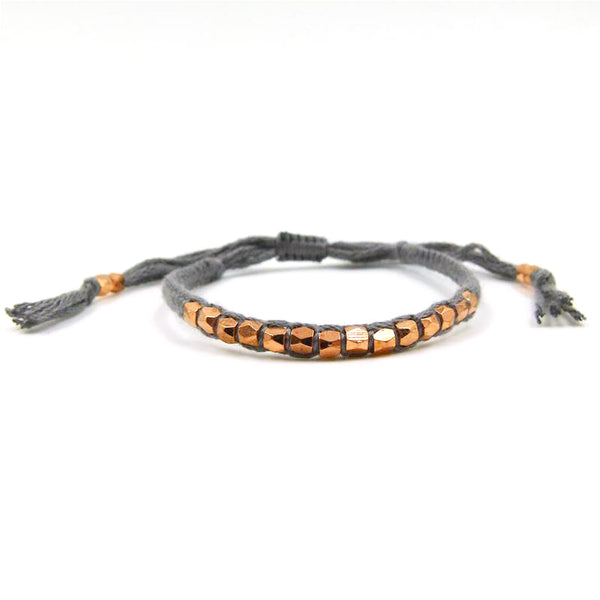 Friendship style bracelet with facetted metal bead detail