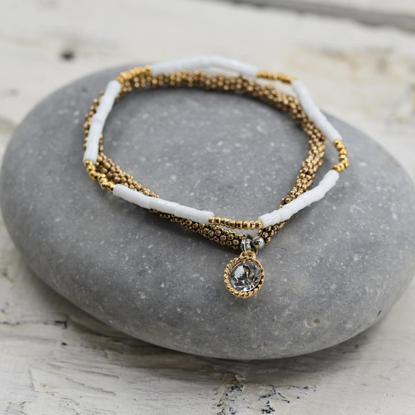 Stretchy bracelet duo in white and gold beads with crystal c
