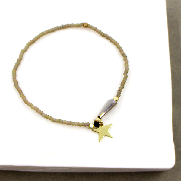 Delicate beaded bracelet with star dropper