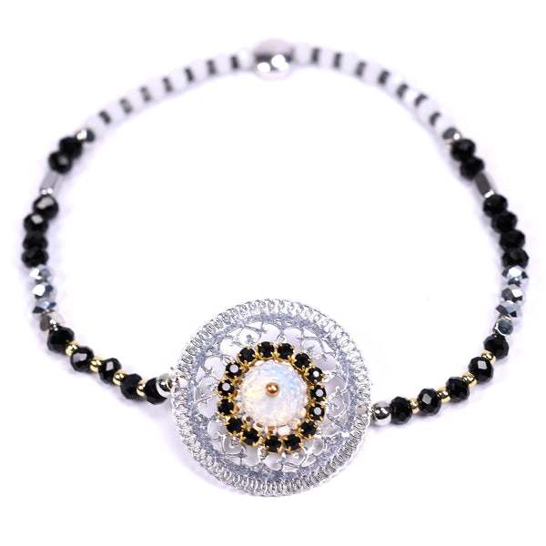 Feature disc with beaded details on delicate bracelet