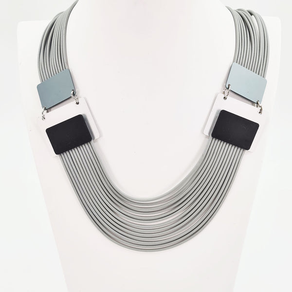 Fine multi strand neoprene statement necklace with square features