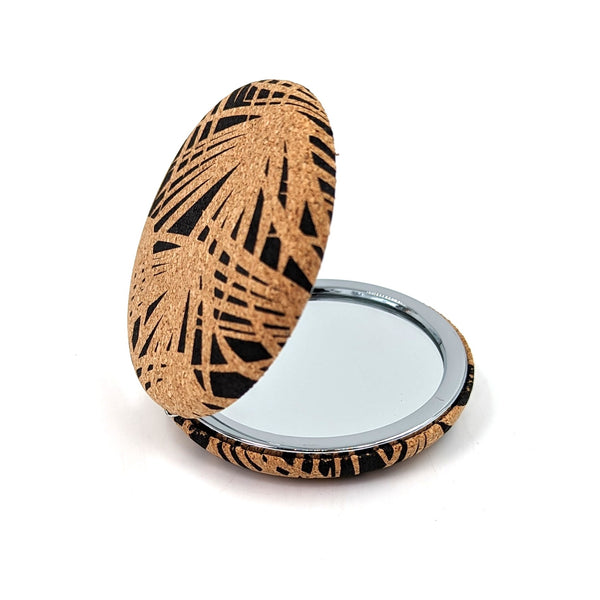 Palm outline on cork circular compact mirror
