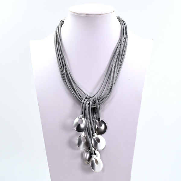 Statement necklace with wax cord and circle shape drop features