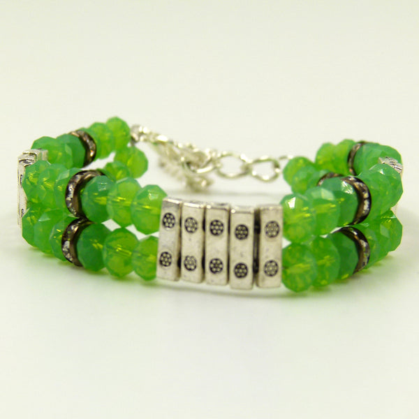 Green cut glass bracelet with clasp and bar spacers
