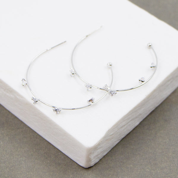 Crystals on hoops earrings