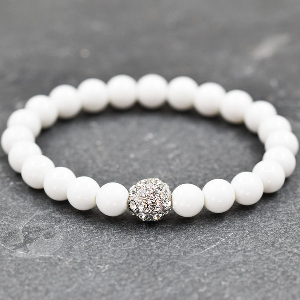 Simple stretchy bead bracelet with central diamante