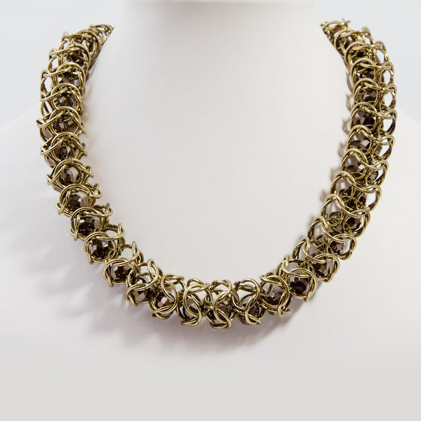 Cut glass beads encased in multi link chain necklace