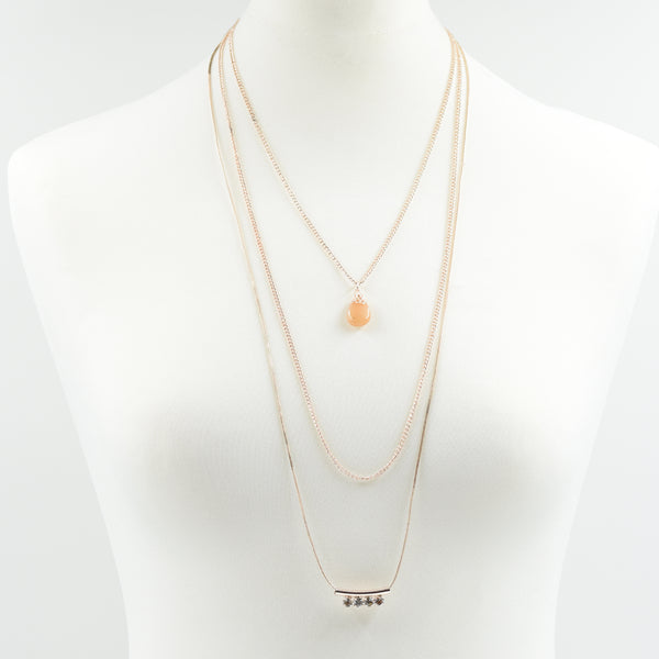 Long necklace with crystal bar pendant and stone detail