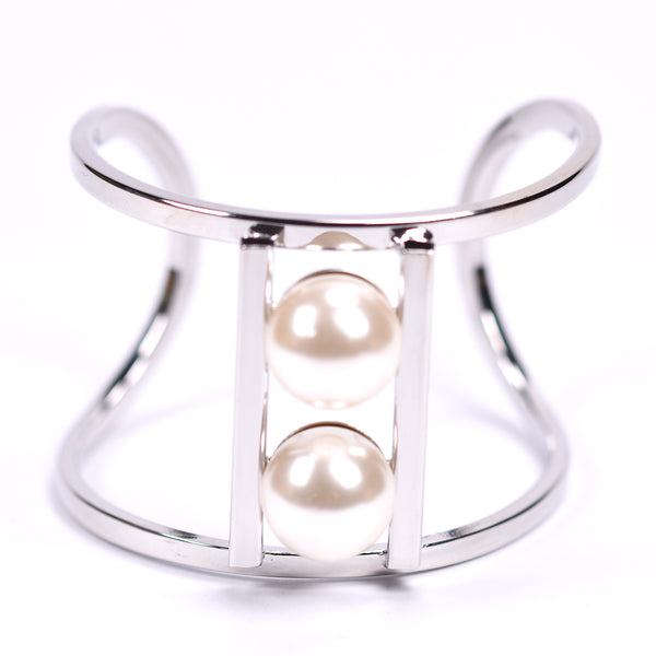 Contemporary open bangle with twin pearl feature