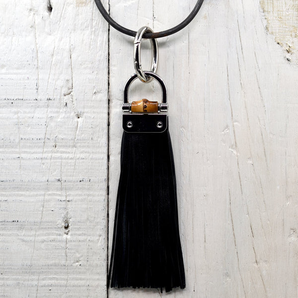 Designer inspired flat leather tassel bag accessory