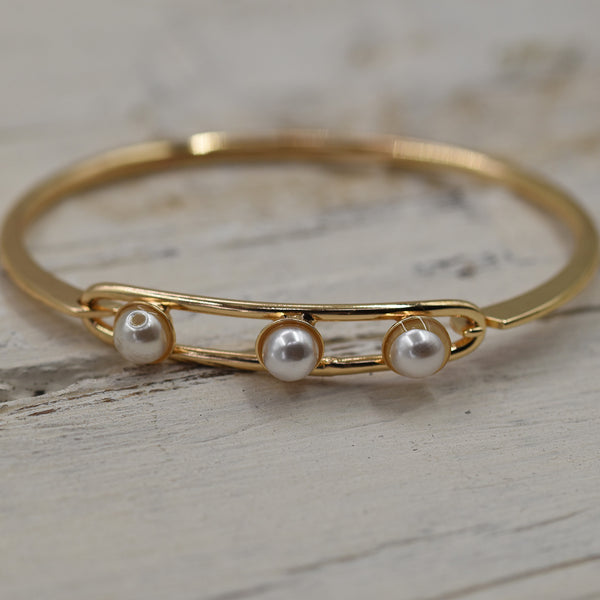 Delicate hook over bangle with three pearls