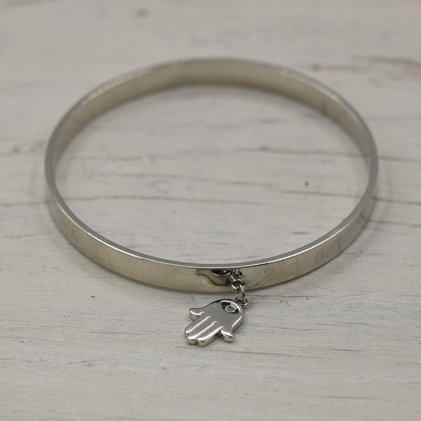 Delicate bangle with small charm