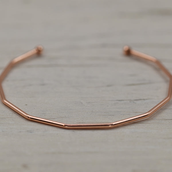 Angled open bangle