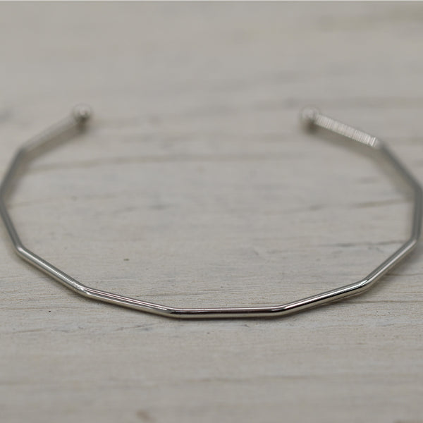 Angled open bangle