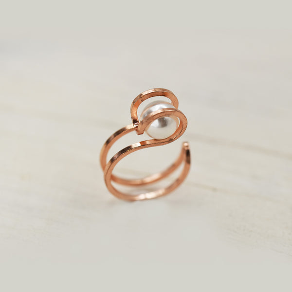 Rose gold caged pearl ring