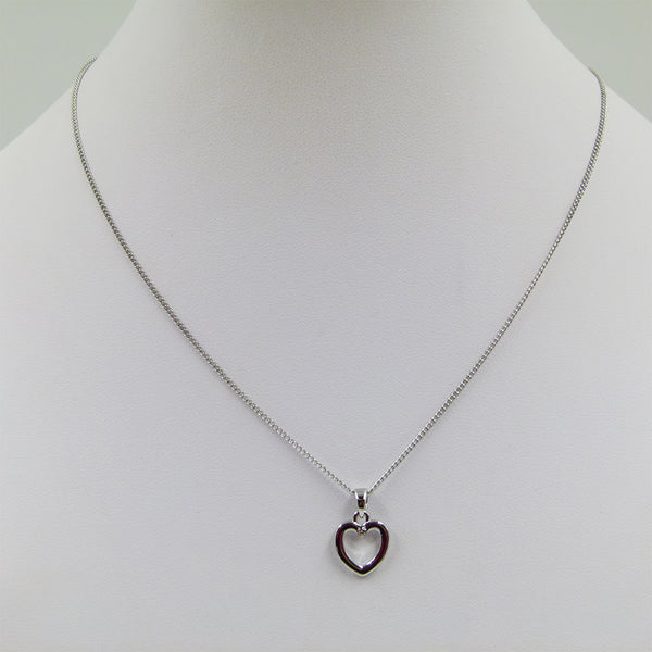 Delicate cut out heart with crystal on short chain