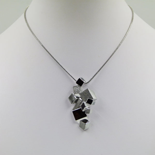 Contemporary mixed  geometric shape pendant on snake chain