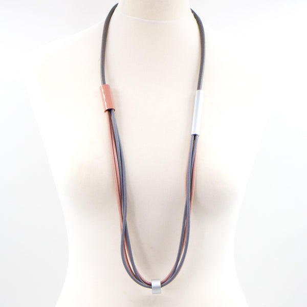 Long grey and pink accent rubber necklace with tube features
