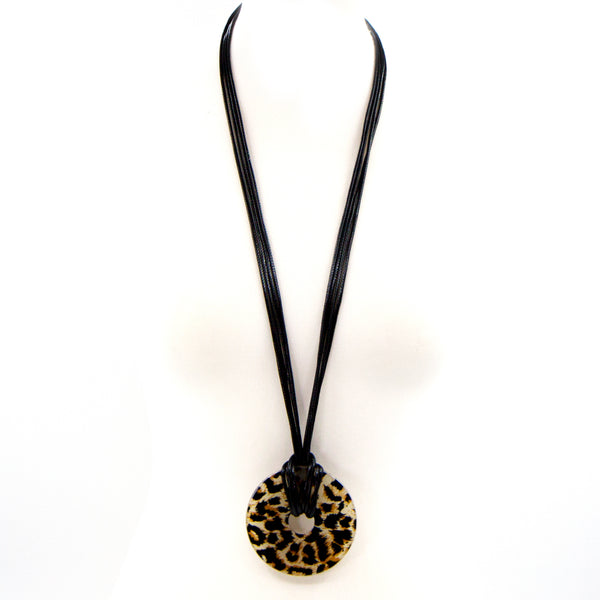 Long tortoiseshell resin ring on long black cord necklace