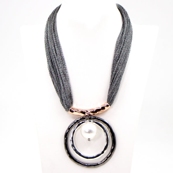 Circle and pearl pendant on short fabric necklace
