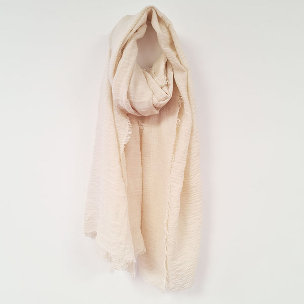 Substantial plain scarf with fashionable raw edge