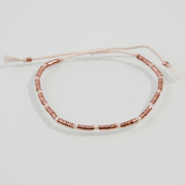 Delicate friendship bracelet with little cylinder beads