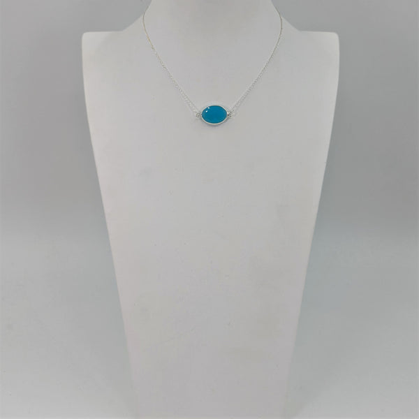 Delicate factetted glass pendant on necklace