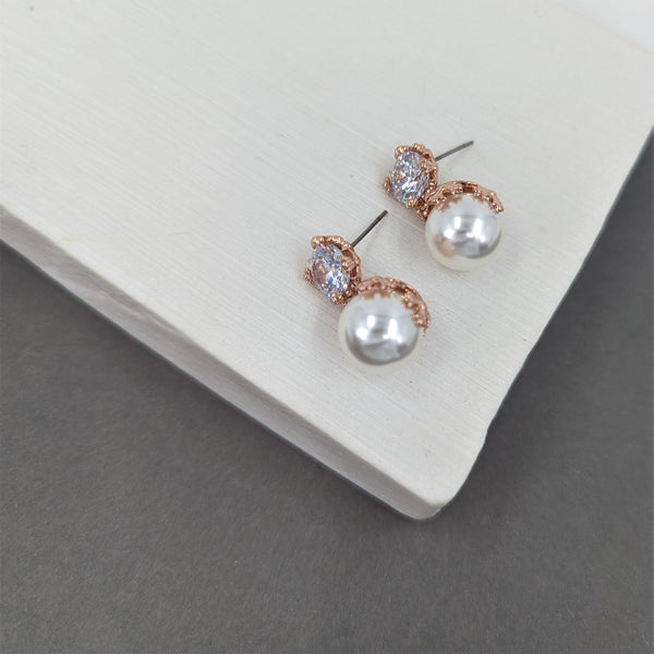 Crystal stud earrings with pearl drop and flower motif