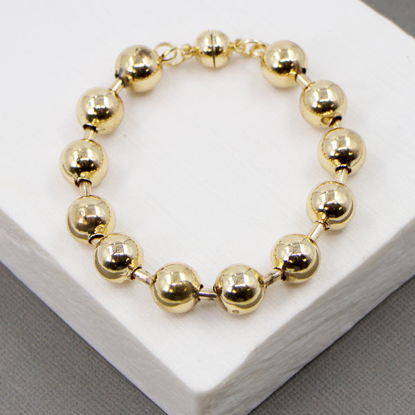 Substantial ball bracelet with magnetic clasp