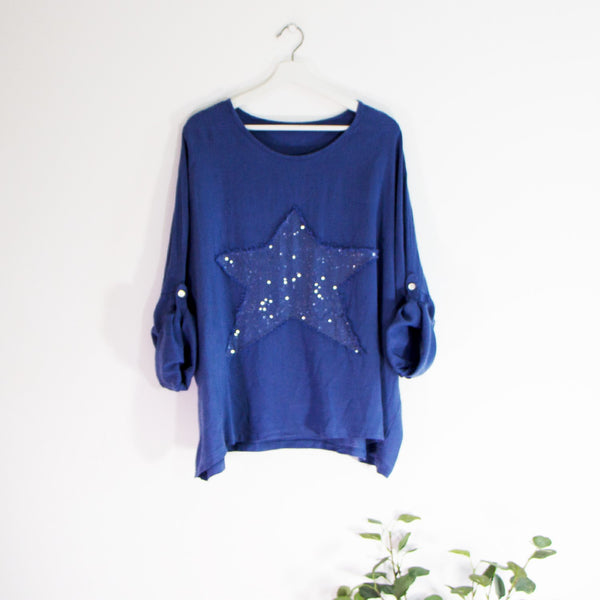 Free size top with sequin star and fashionable frayed edges