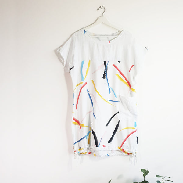 Longline cotton front jersey back top with brush stroke print drawstring detail and pockets