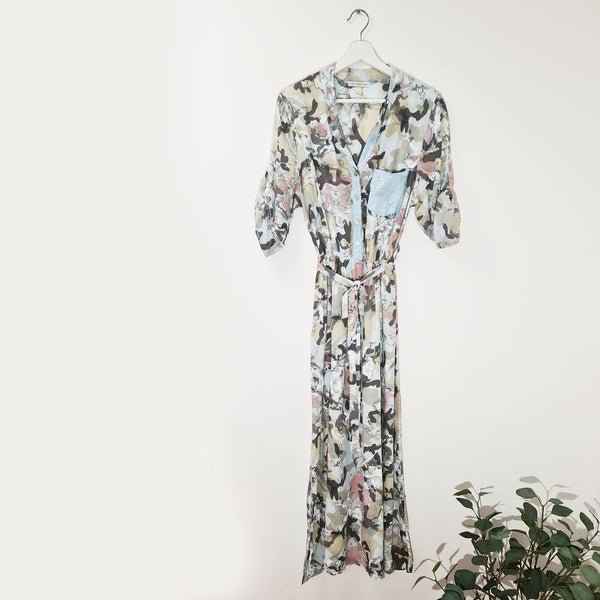 Abstract floral summer dress with elasticated and tie waist with subtle sequin pocket and button down neckline