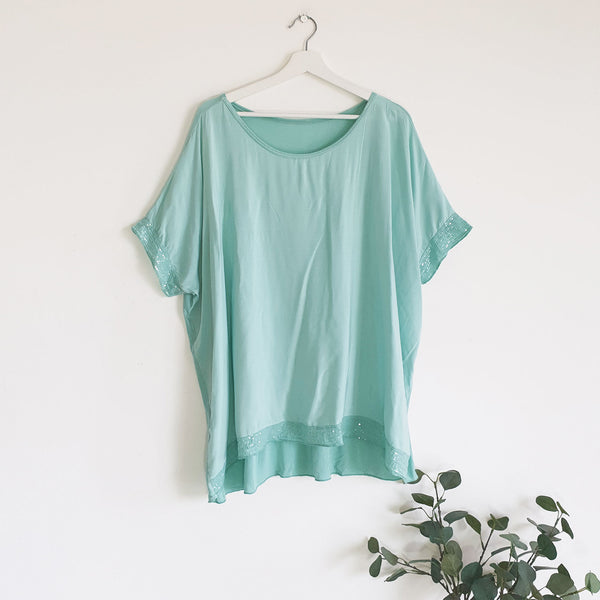 Classic Italian plain subtle sequin edged top