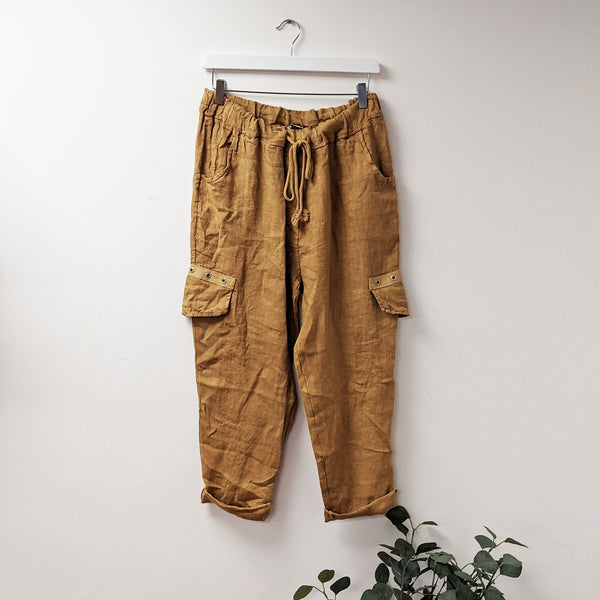 Linen trousers with side pocket detail and eyelet trim