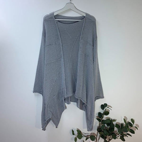Designer style slouchy A-symmetric jumper with random stitch detail