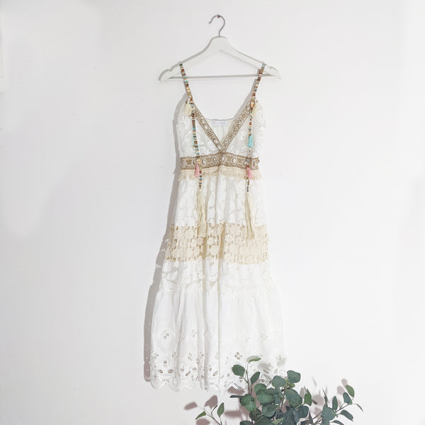 Cotton dress with multi gold straps and shell and tassel elements