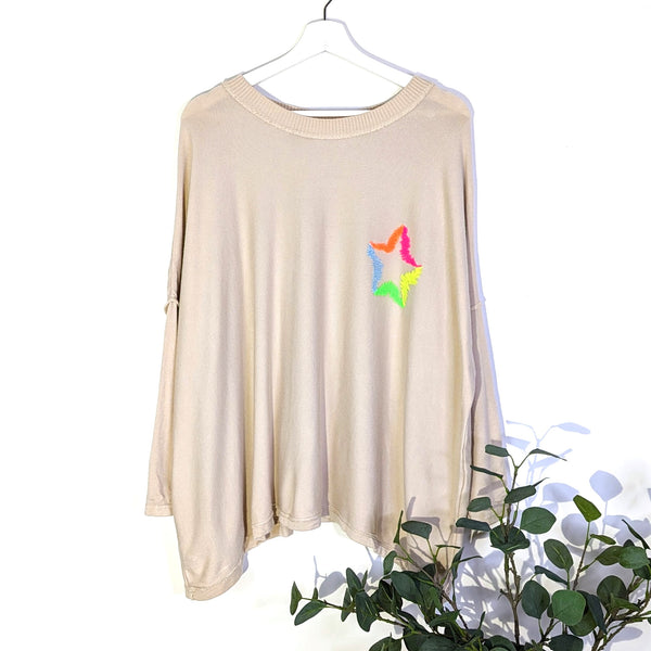 Rayon mix tapered hem top with neon star motif on front