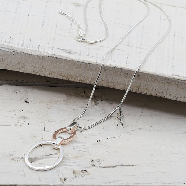 Two tone circle pendants on long snake chain