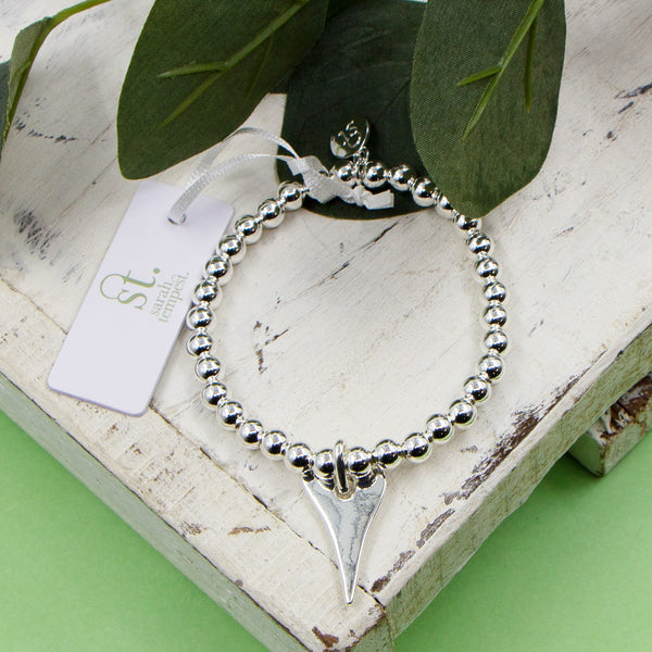 Contemporary heart charm on stretchy beaded bracelet