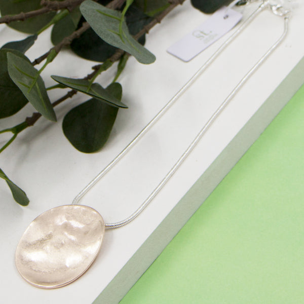 Soft hammered disc pendant on short snake chain necklace