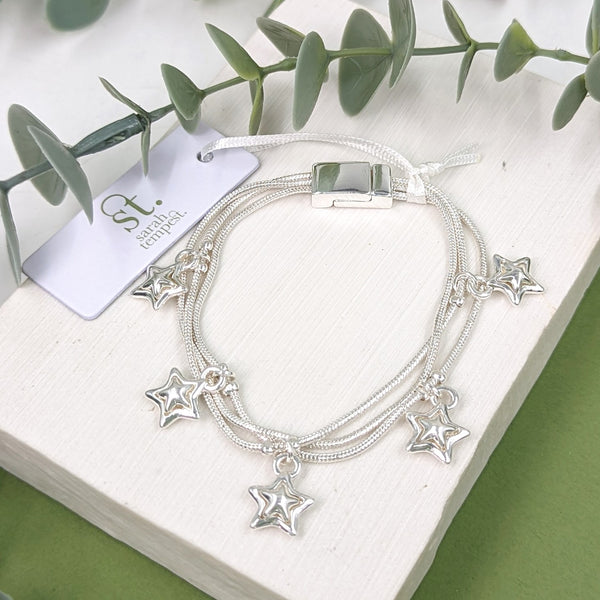 Triple strand magnetic bracelet with little star inlay charms