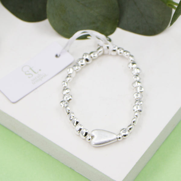 Heart pendant on stretchy beaded bracelet