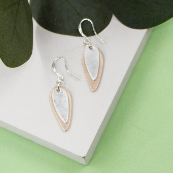 Elongated oval shape charm on fish hook earrings