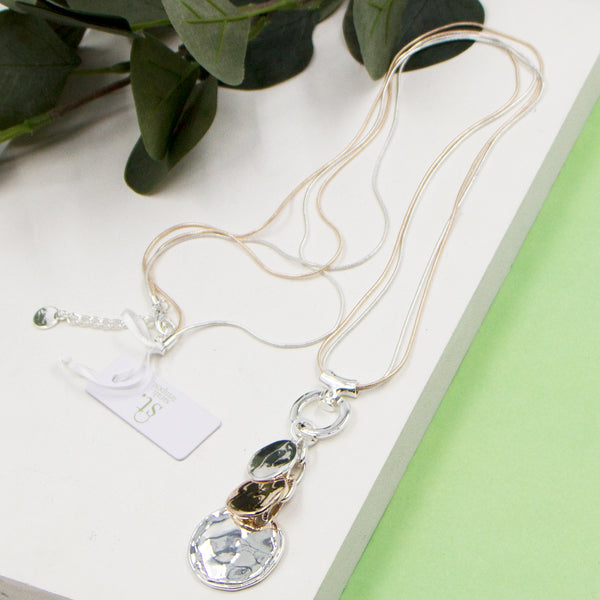 Triple disc pendant on long snake chian necklace