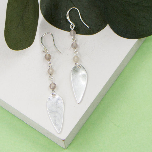 Elongated oval shape charm and beads on fish hook earrings