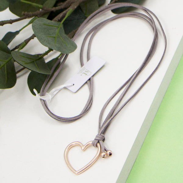 Open heart pendant on grey suede long necklace